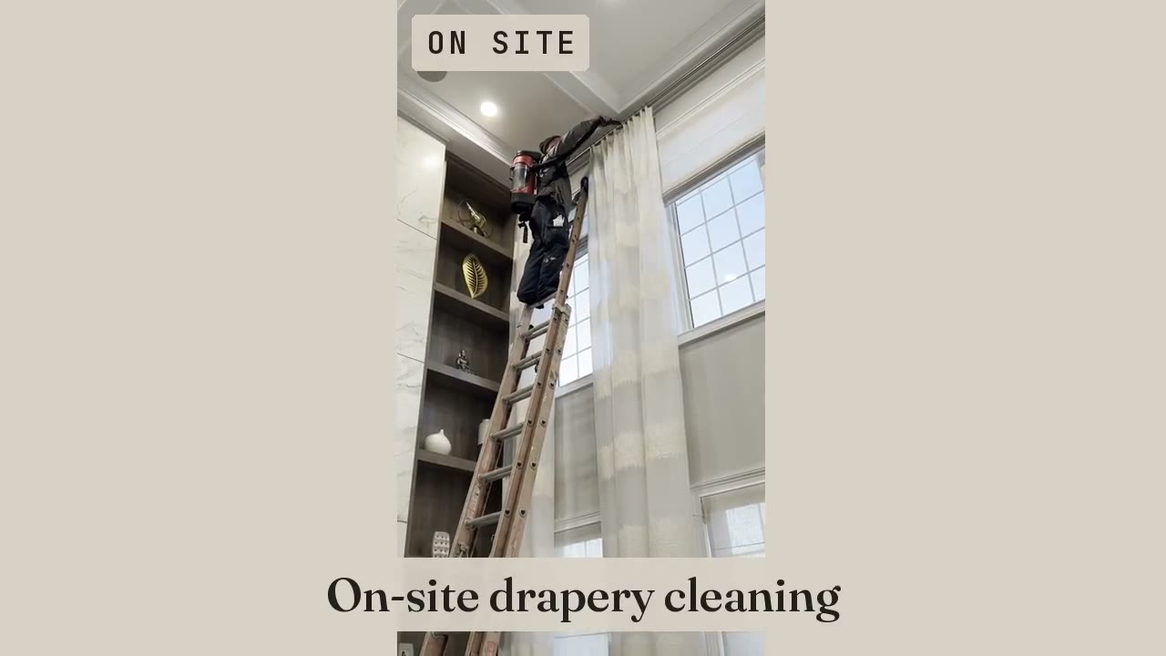 LaLena’s on-site drapery cleaning, with a technician working on hanging panels